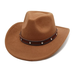 Vintage brown felt western cowboy hat with studded leather band and upturned brim