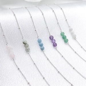 Minimalist 925 silver plated bracelet with three natural stone beads on white silk