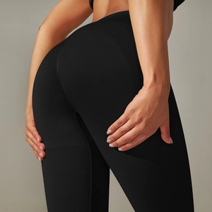 Detail of high-waist seamless yoga leggings with honeycomb texture and push-up effect