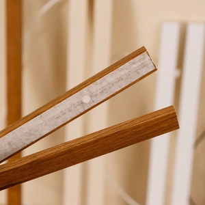 Magnetic wooden poster frame hanger with dark wood grain and strong adhesive tape back