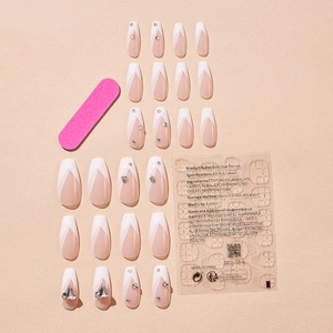 French tip false nails set with plaid patterns, rhinestones, and application tool kit