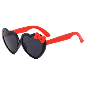 Kids heart-shaped sunglasses in red and black with a cute bow for UV protection