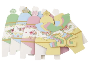 Detailed flat lay of paper teapot candy boxes in green, blue, pink, and yellow hues