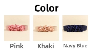 Detailed fabric layers of pink, khaki, and navy blue textile roses on elastic waistbands