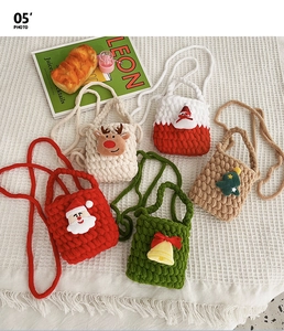 Macro shot of five handmade knit Christmas purses with thick chenille texture and straps