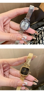 Detail of square quartz watch with flexible metal strap in silver and gold finishes