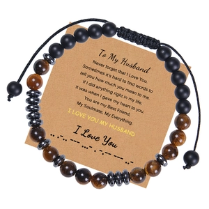 Detail of adjustable tiger eye stone beaded bracelet with Morse code message card