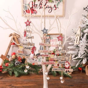 Creative wooden Christmas tree pendants with cartoon motifs and small bells hanging on a tree