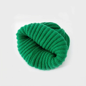 Winter knitted beanie hat in emerald green with a warm ribbed knit texture for adults