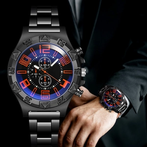 Detailed macro view of black metal sports watch with orange numerals and blue accents