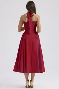 Detail of red halter midi dress showing the elegant back tie-up design and open back