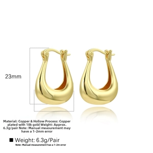 Detailed view of hollow U-shaped gold earrings with 23mm height and 18k gold plating