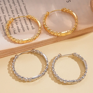 18k gold and silver plated chunky chain link hoop earrings on vintage book page background