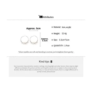 Detail view of silver acrylic flower hoop earrings with size 5.5cm x 5cm and 12.4g weight