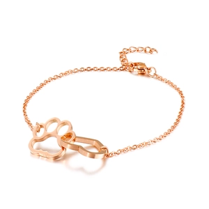 Rose gold chain bracelet featuring interlocking hollow cat paw and heart pendants