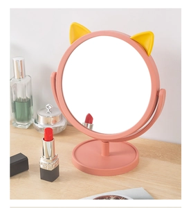 Rotating pink cat ear makeup mirror on desktop with high-definition reflection