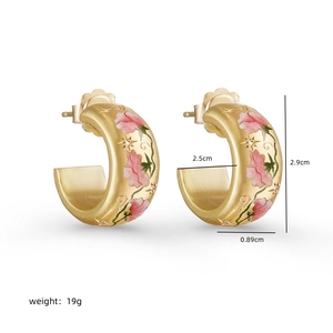 C-shaped stainless steel earrings with painted pink flowers and sparkling zircon details