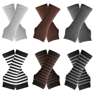 Close-up of knit arm sleeves in solid grey, brown and various striped patterns