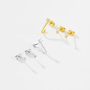 Macro shot of S925 sterling silver minimalist stud earrings with white cubic zirconia