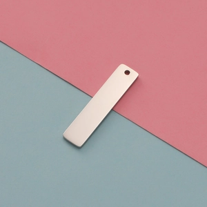 Detailed view of silver rectangular stainless steel blank tag for DIY pendant