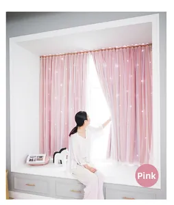 Detail of pink double-layer blackout curtain with hollow star patterns and white sheer lace