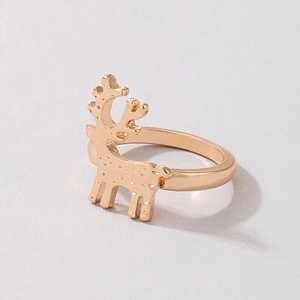 Detail shot of a golden alloy reindeer ring with polka dot patterns for Christmas