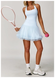 Detail of light blue tennis dress featuring a tiered mesh ruffle skirt and slim fit top