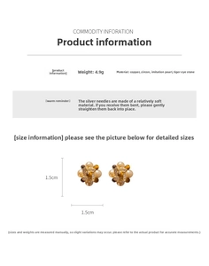 Detailed specs of flower earrings with zircons, pearls, and tiger eye stones