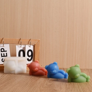 Detail showing sleeping bear silicone mold with red, blue and green finished resin bears
