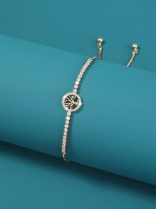 Detail view of adjustable gold Tree of Life bracelet with pavé cubic zirconia inlay