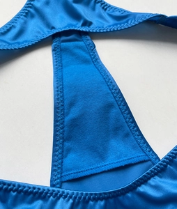 Detail view of blue gradient thong showing silk texture and high density zigzag stitching