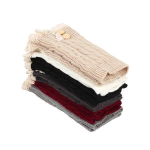 Detail of knitted leg warmers with lace trim and wooden buttons in various colors