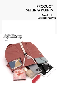 Spacious interior of a brick red nylon drawstring backpack with multiple compartments