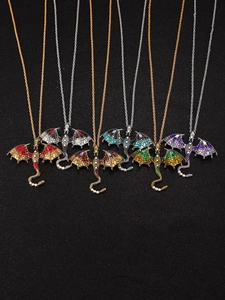 Detail view of colorful dragon pendants with crystal rhinestones in six various colors