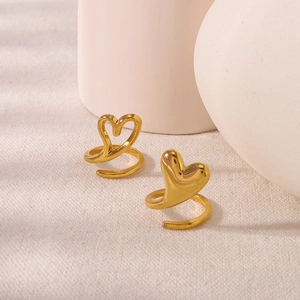 18k gold plated stainless steel hollow and solid heart rings on aesthetic background