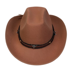 Detailed top view of a brown wool felt cowboy hat with a metal bull head buckle