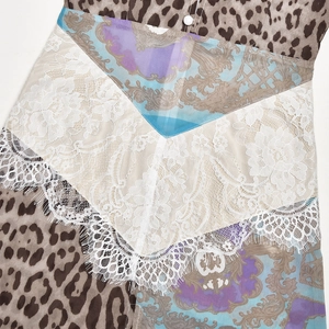 Detail view of leopard print and baroque chiffon fabric stitching with delicate lace trim