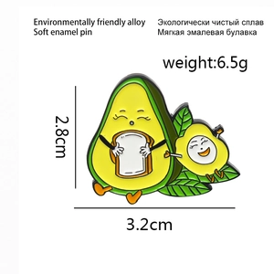 Detail view of avocado soft enamel brooch showing size dimensions 2.8cm and 3.2cm