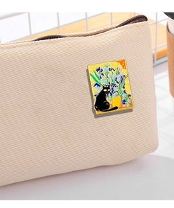 Detail of artistic enamel pin featuring Van Gogh Iris style with a cute black cat motif
