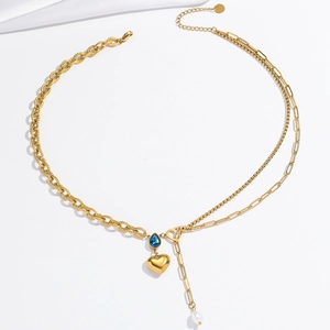 Gold double-layer necklace with blue teardrop zircon, heart pendant, and pearl tassel