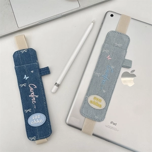 Detail of denim pencil case with butterfly embroidery and elastic band for iPad stylus