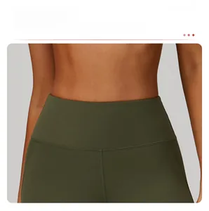 Detail of high-waisted olive green yoga pants with tummy control and seamless stitching