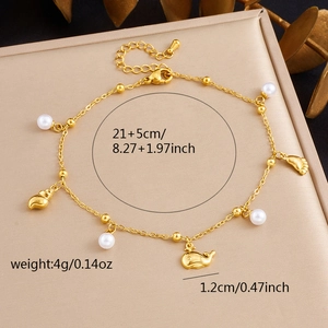 Detail of gold beach anklet with seashell, whale, and pearl charms, 21+5cm length
