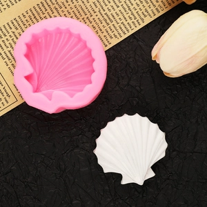 Pink seashell silicone mold for fondant and soap with a finished white shell display