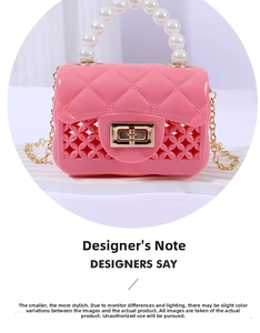 Detail of pink jelly bag with quilted texture, pearl handle and gold chain strap
