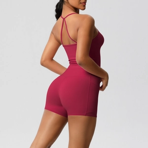 Detail of cross-back yoga top and high-waist shorts with side pocket in dark rose