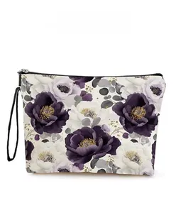 Detail showing elegant purple rose floral patterns on a white canvas makeup pouch
