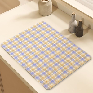 Absorbent purple and yellow checkered drying mat for kitchen countertop and coffee machines