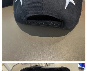 Vue détaillée de la sangle réglable à 7 trous en plastique et broderie d'étoile sur la casquette