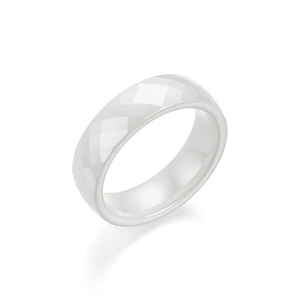 Minimalist white ceramic ring with geometric diamond-cut facets and polished finish